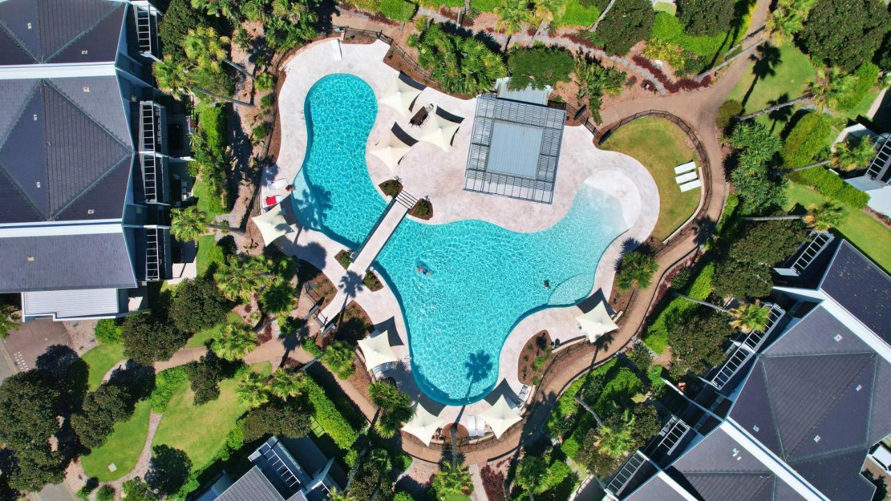 Pullman Magenta Shores Resort Entrance Eksteriør billede Aerial view of the pool at the 2018 Commonwealth Games